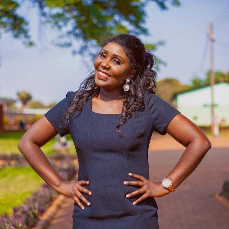 Alex Morgan, Lead Design Curator at Quiet Horizon Stories, reviewing corporate floral arrangements